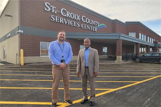 Wisconsin Department of Veterans Affairs Secretary James Bond and St. Croix County Veterans Service Director Phil Landgraf in front of the County's Services Center.