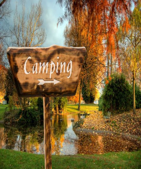 Camping Sign by Pond in Fall