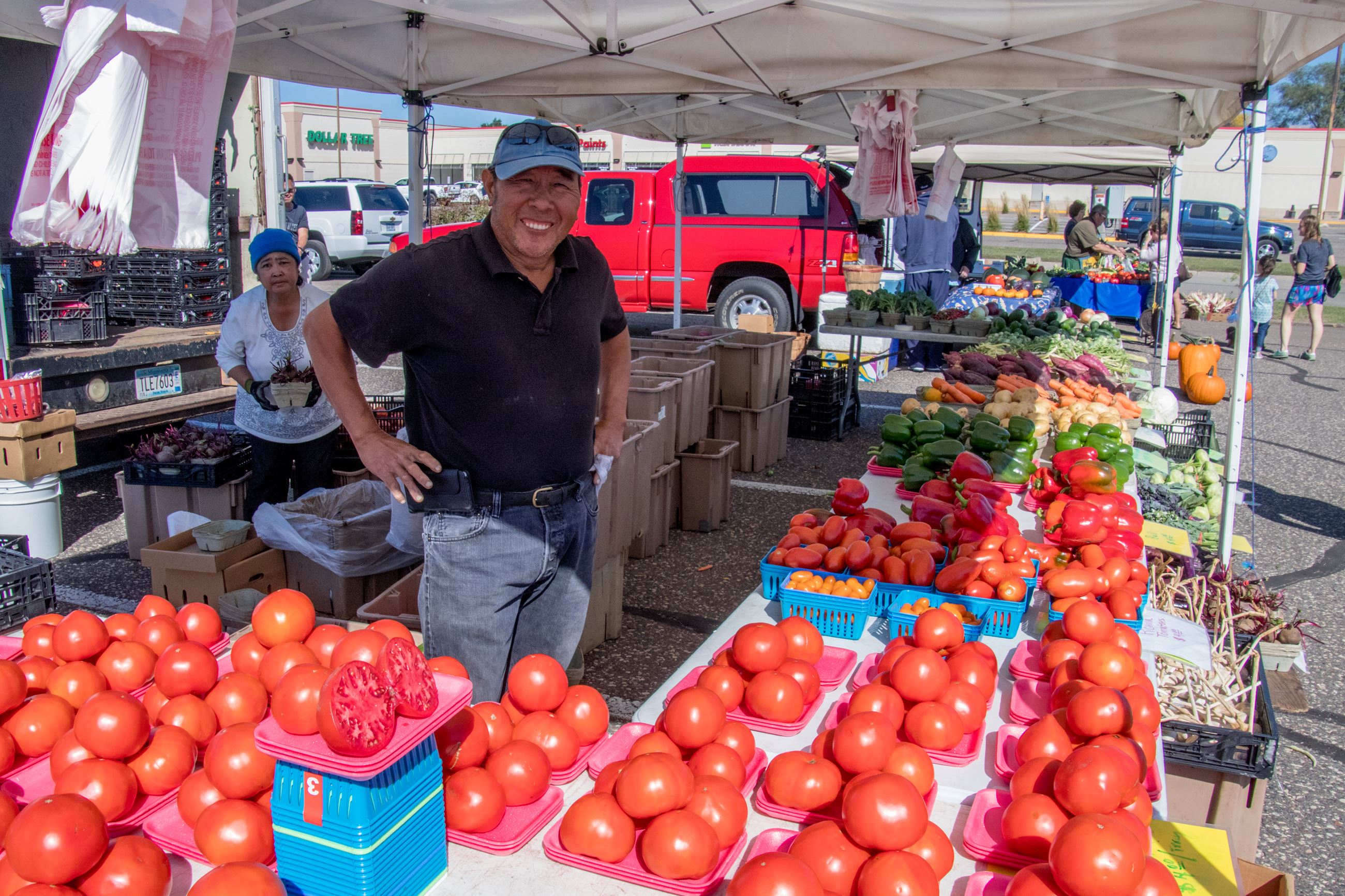 Farmers Market Man Selling Tomatos
