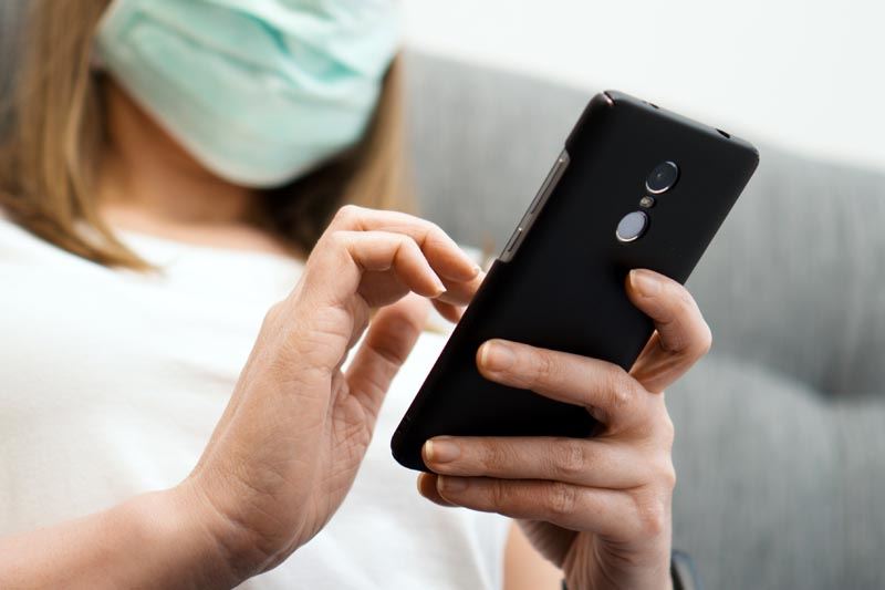 A person holding a cell phone.