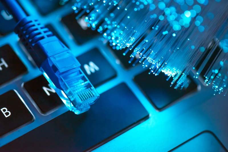 A laptop and cables that provide internet connection