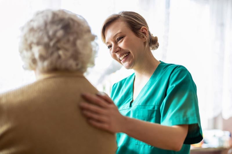 A nurse caring for a woman.