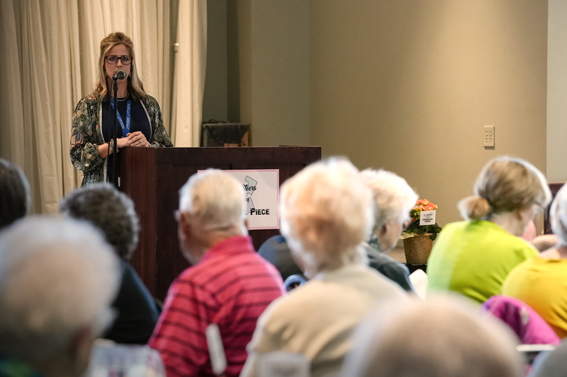 Kristin Newton speaking to an audience of ADRC volunteers being recognized for their service.
