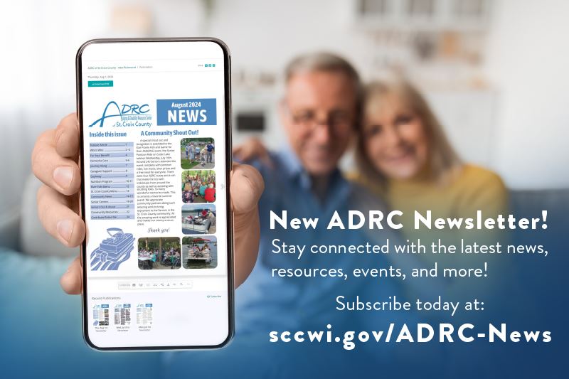 An older couple holding a cell phone showing the ADRC's digital newsletter.