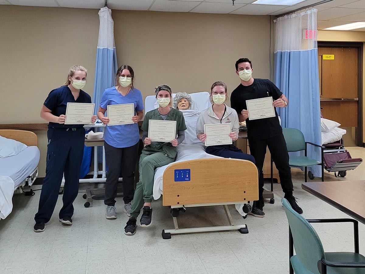 Photo of graduates of St. Croix County Health and Rehab Center’s Nursing Assistant Program holding t